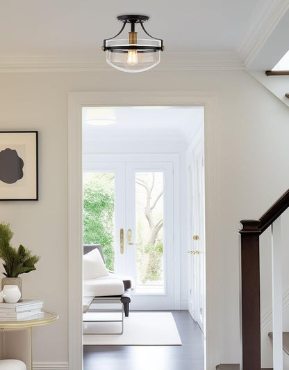 Kira Home Zurich 12" Modern Industrial Semi-Flush Mount Ceiling Light, Two-Tone Fixture with Clear Glass Schoolhouse Bowl Shade, Warm Brass and Black Finish