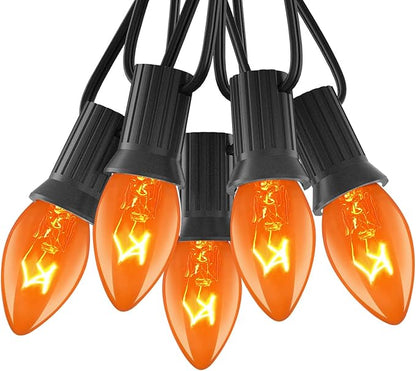 Abeja 25Ft C7 Orange String Lights with 27 Clear Orange Bulbs (2 Spare) - Vintage Halloween String Lights on Black Wire for Patio, Party & Spooky Decor